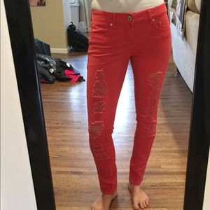 Orange distressed skinny jeans size 7.